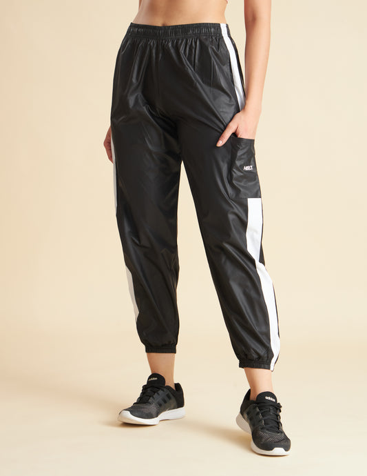 Women Black NS Loose Fit Solid Training Woven Joggers