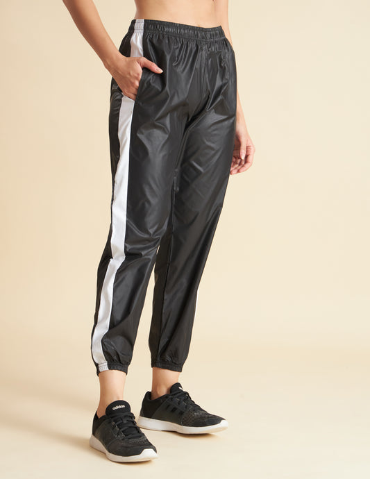 Women Black NS Loose Fit Solid Training Woven Joggers